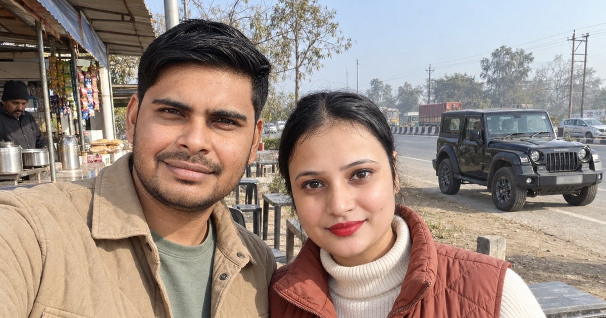 Nav and Vandana holding paper cups of tea at a highway stall in January 2026, their black Thar parked behind them.